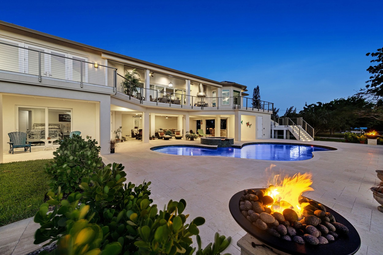 Twilight back exterior of a custom home by J.F. Smith Building Contractors, Lee County FL