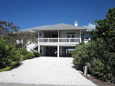Teal custom home by J.F. Smith Building Contractors, Lee County FL